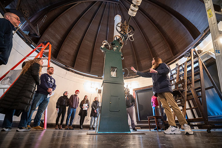 A Ph.D. student talks to visitors during an open house at IU's Kirkwood Observatory.